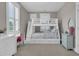 Bright bedroom featuring a white bunk bed with storage underneath and a desk by the window at 1556 Cranes Nest Rd, Mount Pleasant, SC 29466