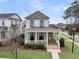 Inviting two-story home with a charming front porch, offering a relaxing outdoor space at 1556 Cranes Nest Rd, Mount Pleasant, SC 29466