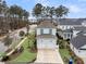 Charming home with a two-car garage, well-manicured lawn, and mature palm trees at 1556 Cranes Nest Rd, Mount Pleasant, SC 29466
