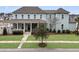 Charming two-story home with a welcoming front porch and beautifully landscaped front yard at 1556 Cranes Nest Rd, Mount Pleasant, SC 29466