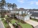 Charming home with a two-car garage, well-manicured lawn, and mature palm trees at 1556 Cranes Nest Rd, Mount Pleasant, SC 29466