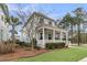 Charming home with a wrap-around porch, perfect for enjoying outdoor living and neighborhood views at 1556 Cranes Nest Rd, Mount Pleasant, SC 29466