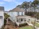 Two-story home with a spacious porch perfect for enjoying the outdoors, plus lush landscaping at 1556 Cranes Nest Rd, Mount Pleasant, SC 29466