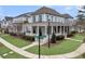 Beautiful home featuring a spacious porch, complemented by manicured landscaping and a street view at 1556 Cranes Nest Rd, Mount Pleasant, SC 29466