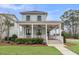 Inviting home with a wide front porch, complete with ceiling fans, perfect for outdoor enjoyment at 1556 Cranes Nest Rd, Mount Pleasant, SC 29466