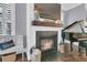 Close-up of a fireplace with a wooden mantel and a TV above, adding warmth to the space at 1556 Cranes Nest Rd, Mount Pleasant, SC 29466