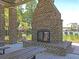 Outdoor pavilion fireplace with brick construction and metal screen at 1556 Cranes Nest Rd, Mount Pleasant, SC 29466