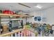 Spacious garage with overhead storage and plenty of room for parking and hobbies at 1556 Cranes Nest Rd, Mount Pleasant, SC 29466