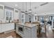 Bright, open-concept kitchen features an island, stainless appliances and leads to a dining and living area at 1556 Cranes Nest Rd, Mount Pleasant, SC 29466