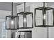 Stylish black modern pendant lights illuminate the kitchen island at 1556 Cranes Nest Rd, Mount Pleasant, SC 29466
