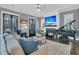 Comfortable living room with fireplace, piano, and blue accents at 1556 Cranes Nest Rd, Mount Pleasant, SC 29466
