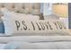 A close up on the pillows on the bed that read P.S. I LOVE YOU at 1556 Cranes Nest Rd, Mount Pleasant, SC 29466