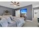 Spacious main bedroom with a view of the mounted TV and the ensuite bathroom at 1556 Cranes Nest Rd, Mount Pleasant, SC 29466