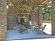 Inviting outdoor pavilion featuring brick columns, exposed wood beams, and comfortable Adirondack seating area at 1556 Cranes Nest Rd, Mount Pleasant, SC 29466