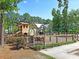 Fenced community playground with a ship structure, slides, and swings at 1556 Cranes Nest Rd, Mount Pleasant, SC 29466
