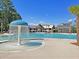 Community pool area featuring a splash fountain and ample deck space at 1556 Cranes Nest Rd, Mount Pleasant, SC 29466