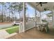 Inviting front porch with outdoor dining set, a perfect space for entertaining and enjoying the neighborhood view at 1556 Cranes Nest Rd, Mount Pleasant, SC 29466