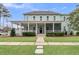 Inviting front porch with rocking chairs, pillows and a screened door, creating a cozy outdoor retreat at 1556 Cranes Nest Rd, Mount Pleasant, SC 29466
