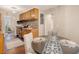 Charming dining area with a rustic table, chairs, and wood floors at 1600 Larry St, North Charleston, SC 29406