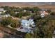 Coastal home with a paver driveway, two-car garage, pool, and lush greenery near marshland at 1648 Home Farm Rd, Mount Pleasant, SC 29464