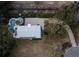 Aerial view of home featuring a private pool, patio, lush landscaping, and a paver driveway at 1648 Home Farm Rd, Mount Pleasant, SC 29464
