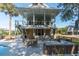 The home's backyard featuring an outdoor dining area and a partial pool view at 1648 Home Farm Rd, Mount Pleasant, SC 29464