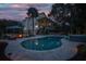 Expansive backyard with pool, hot tub, fire pit, and outdoor seating, ideal for entertaining and enjoying outdoor living at 1648 Home Farm Rd, Mount Pleasant, SC 29464