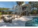 Beautiful backyard featuring a patio area, built-in fire pit, and partial view of the pool at 1648 Home Farm Rd, Mount Pleasant, SC 29464