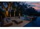 Nighttime view of backyard featuring a hot tub, pool, and ample seating perfect for luxurious outdoor entertainment at 1648 Home Farm Rd, Mount Pleasant, SC 29464