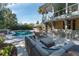 Spacious backyard with a pool, outdoor seating and dining areas at 1648 Home Farm Rd, Mount Pleasant, SC 29464