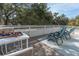 The balcony offers a peaceful spot to relax with two chairs, a table, and a view of the trees at 1648 Home Farm Rd, Mount Pleasant, SC 29464