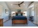 Airy bedroom with a ceiling fan, blue rug, and desk setup at 1648 Home Farm Rd, Mount Pleasant, SC 29464