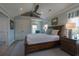 Bright bedroom featuring a ceiling fan, light blue walls and coastal furnishings at 1648 Home Farm Rd, Mount Pleasant, SC 29464