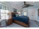 Bright bedroom featuring a ceiling fan, blue rug, and many windows at 1648 Home Farm Rd, Mount Pleasant, SC 29464
