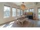 Bright dining area with a stylish chandelier, large windows, and lots of natural light at 1648 Home Farm Rd, Mount Pleasant, SC 29464