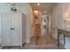 Bright entryway with hardwood floors, decorative cabinet, stairway, and views to the living area at 1648 Home Farm Rd, Mount Pleasant, SC 29464