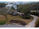 Charming two-story coastal home with a silver roof, a paver driveway, and beautifully landscaped grounds at 1648 Home Farm Rd, Mount Pleasant, SC 29464