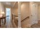 Bright hallway with hardwood floors and staircase leading to the bedrooms at 1648 Home Farm Rd, Mount Pleasant, SC 29464