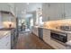 Modern kitchen with stainless steel appliances, granite countertops, and open dining area at 1648 Home Farm Rd, Mount Pleasant, SC 29464