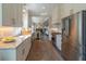Bright, open kitchen with stainless steel appliances, white cabinetry, and a stylish runner at 1648 Home Farm Rd, Mount Pleasant, SC 29464