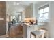 A bright kitchen featuring stainless steel appliances, granite countertops, and a breakfast bar at 1648 Home Farm Rd, Mount Pleasant, SC 29464
