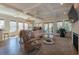 Living room view highlighting a fireplace, hardwood floors, and backyard access at 1648 Home Farm Rd, Mount Pleasant, SC 29464