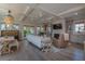 An open-concept living room with a fireplace, hardwood floors, and backyard access at 1648 Home Farm Rd, Mount Pleasant, SC 29464