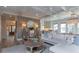 An open-concept living room with hardwood floors, natural light, and access to the kitchen at 1648 Home Farm Rd, Mount Pleasant, SC 29464
