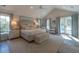 The main bedroom features a vaulted ceiling, hardwood floors, and access to the balcony at 1648 Home Farm Rd, Mount Pleasant, SC 29464