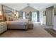 The main bedroom features a vaulted ceiling and access to a private balcony at 1648 Home Farm Rd, Mount Pleasant, SC 29464