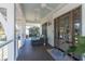 Inviting outdoor porch with wicker sofa, ceiling fans and serene ambiance at 1648 Home Farm Rd, Mount Pleasant, SC 29464