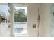 Well-lit shower features sleek fixtures, built-in shelving, and a clear view of the scenic outdoors through a bright window at 1648 Home Farm Rd, Mount Pleasant, SC 29464