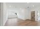 Bright bedroom with hardwood floors, white walls, recessed lighting, and a door leading to a bathroom at 1742 Cultivation Ln # 531, Mount Pleasant, SC 29466