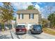 Two-story home with a two-car garage and well-maintained driveway featuring parked cars at 1769 Greenspoint Court, Mount Pleasant, SC 29466